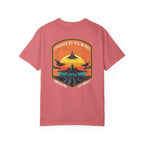 Watermelon t-shirt with graphic of fighter jets and sunset text Covered By His Wings on back