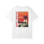 White t-shirt with a graphic design of a sunset, palm tree, and jeep.