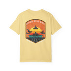 Butter t-shirt with graphic of fighter jets and sunset text Covered By His Wings on back